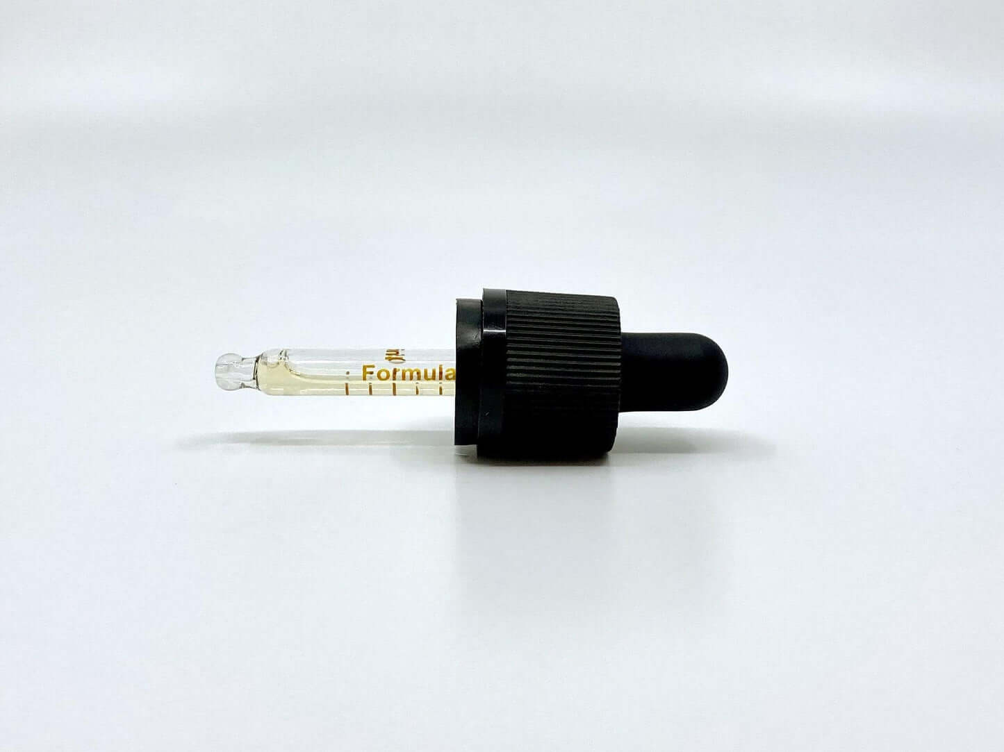 orange Ölpipette weißer hintergrund